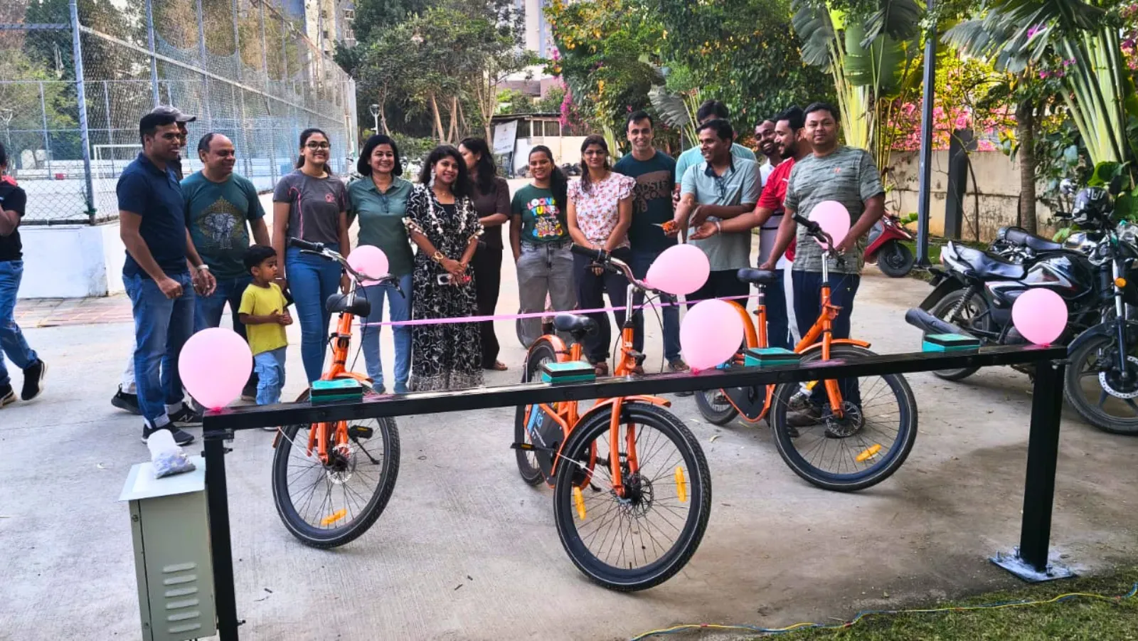 Residents at the launch of a Tilt cycle-sharing station in Candeur Landmark
