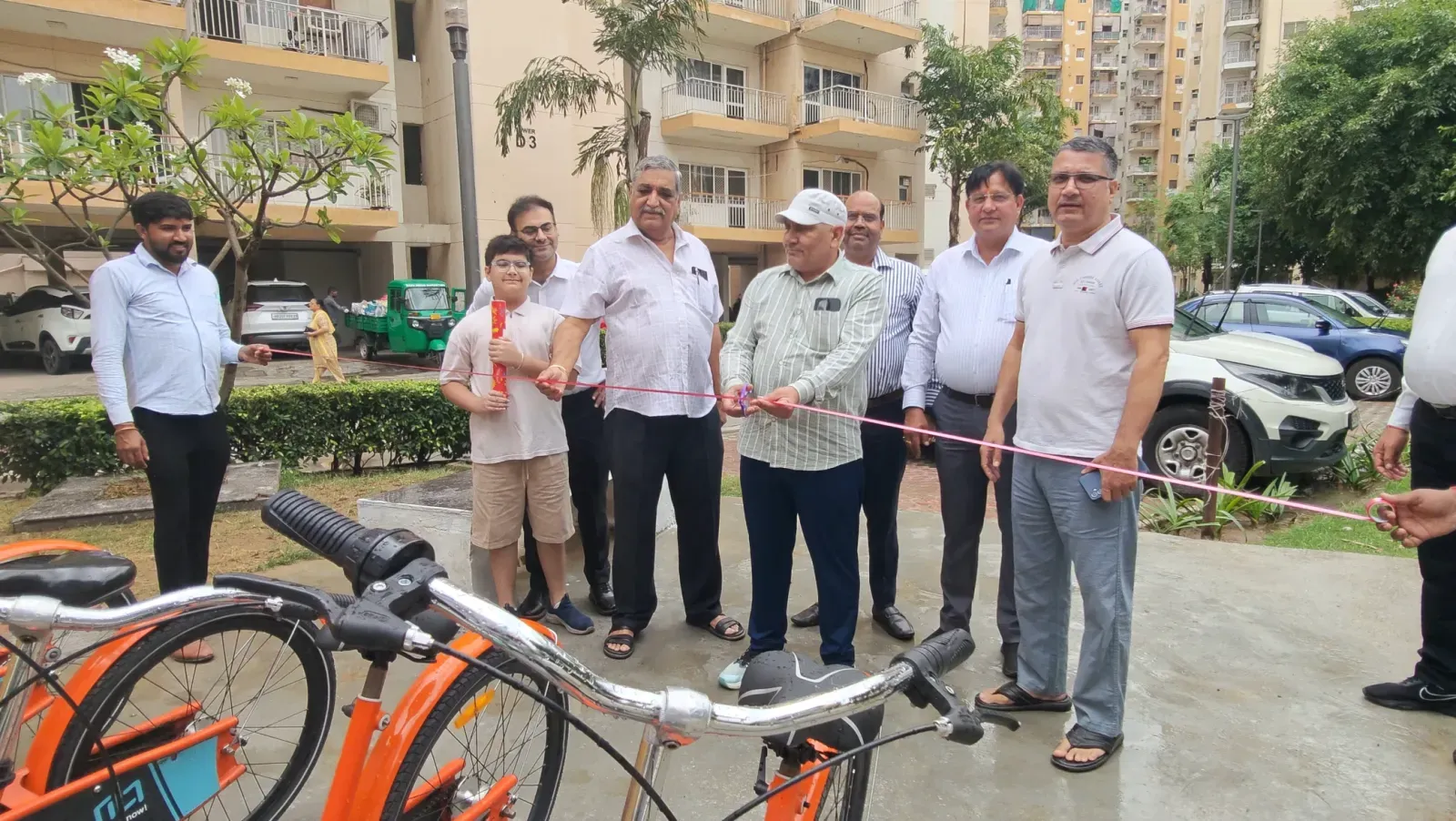Residents at the launch of a Tilt cycle-sharing station in Orris Carnation